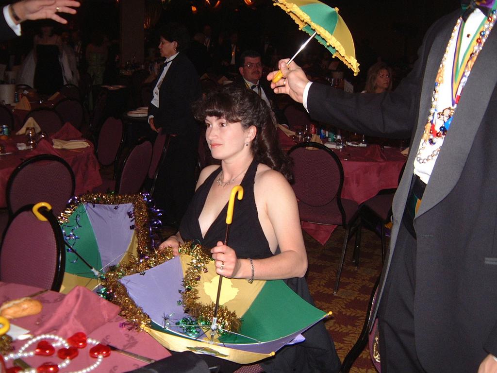 2003/01(Jan)/03(Coronation-Ball-New-Orleans)/1024x768_2003-01-18-12-Coronation-Bal-Susie-Fixing-Umbrella.JPG