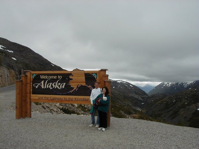 2000/07(July)/Alaska-Cruise/800x600_2000-07-06-Alaska-Cruise-15-Travis-Chance-Suzi-ALASKA-Sign-Skagway.jpg