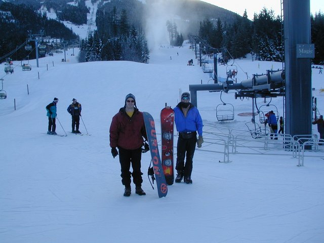2001-02-12-Whistler-2-Justin-Travis-with-boards-at-base-of-Blackcomb.JPG