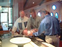 2001-08-18-Dax-Baptism-08-FatherTom-Travis-Dax-Josh-water.jpg