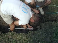2001-09-03-Travis-Stan-fixing-broken-water-pipe-Labor-Day-2-testing-threads.JPG