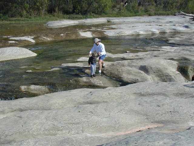 2001-10-26-Camping-McKinney-Falls-18-Jim-Aaron-crossing-falls.JPG
