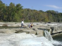 2001-10-26-Camping-McKinney-Falls-15-Chance-Aaron-Travis-Jim-at-falls.JPG
