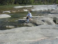 2001-10-26-Camping-McKinney-Falls-18-Jim-Aaron-crossing-falls.JPG