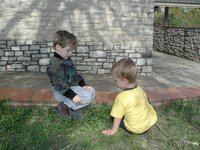 2001-10-26-Camping-McKinney-Falls-24-Chance-Aaron-blowing-dandylion.JPG