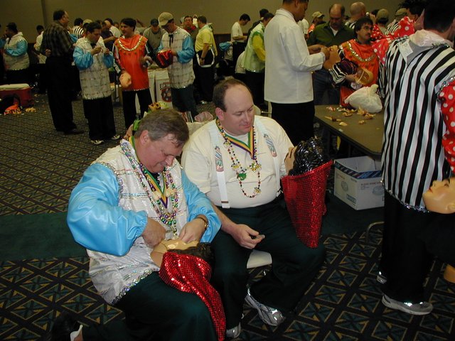 2002/02(February)/MardiGras/640x480_2002-02-09-03-preparing-for-parade-Jim-John-cutting-masks.JPG