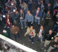 2002-02-07-Mardi-Gras-Balcony-5-beads-midair.JPG