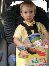 2002-03-31-Easter-02-Chance-choosing-from-toy-catalog.JPG
