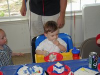 2002-05-05-Dax-Bday-26-eating-cake.JPG