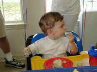 2002-05-05-Dax-Bday-29-eating-cake.JPG