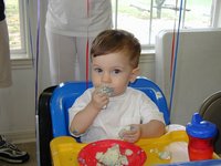 2002-05-05-Dax-Bday-30-eating-cake.JPG