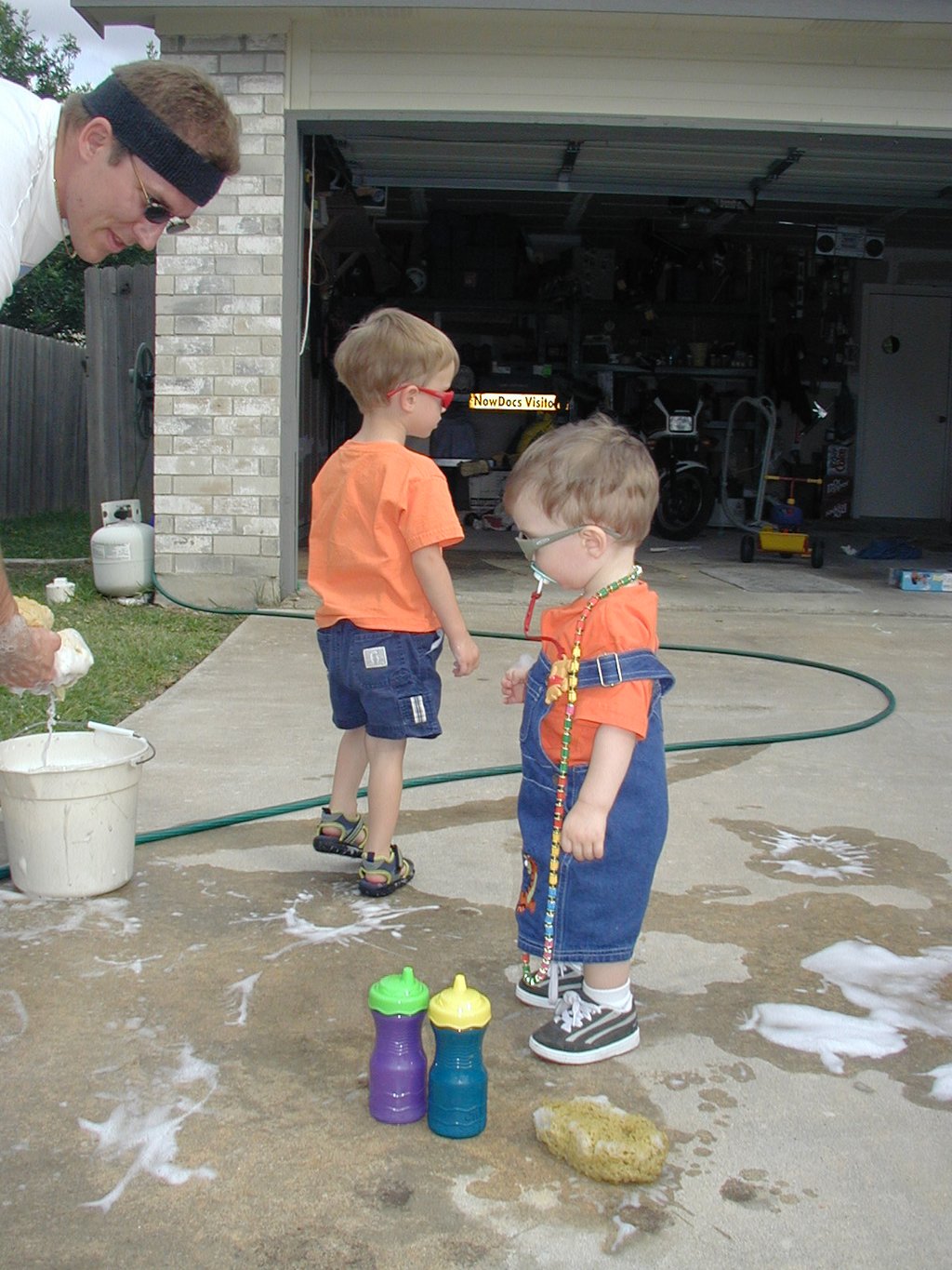 2002-05-27-3-Dax-Chance-Travis-washing-car-sunglasses.JPG