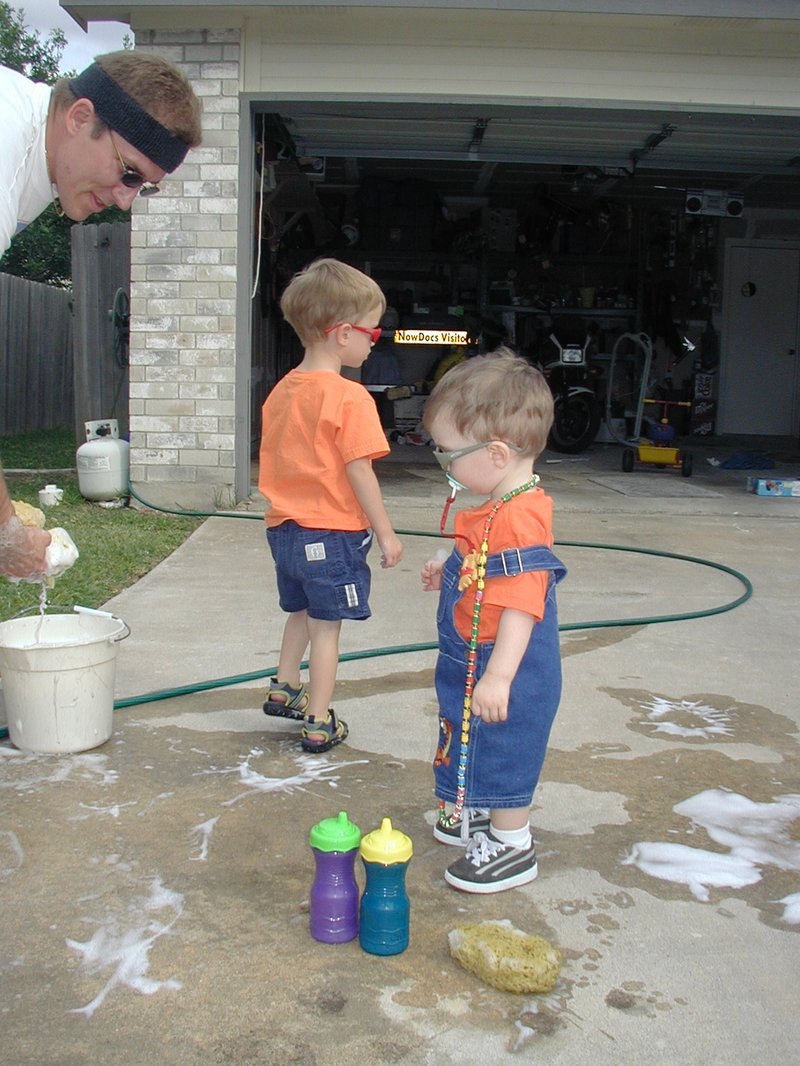 2002-05-27-3-Dax-Chance-Travis-washing-car-sunglasses.JPG