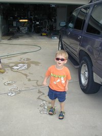 2002-05-27-7-Chance-washing-car-sunglasses.JPG