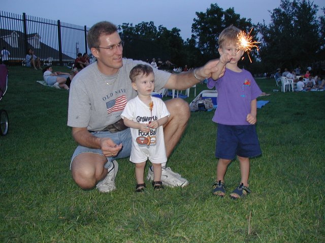 2002/07(July)/4th-of-July/640x480_2002-07-04-06-Travis-Chance-Dax-sparkler.JPG
