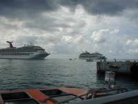 2002-08-08-13-Grand-Cayman-view-from-tender-Carnival-and-Voyager-of-Seas.JPG