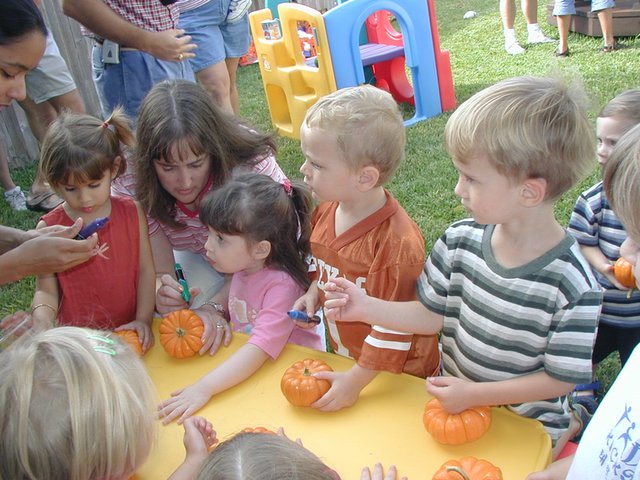 2002-10-05-Chance-3rd-Bday-09-coloring-pumpkins.JPG