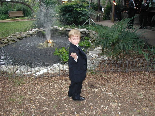 2002/10(October)/Josh-Heather-Wedding/640x480_2002-10-13-020-Josh-Heather-Wedding-Chance-tux-rock.JPG