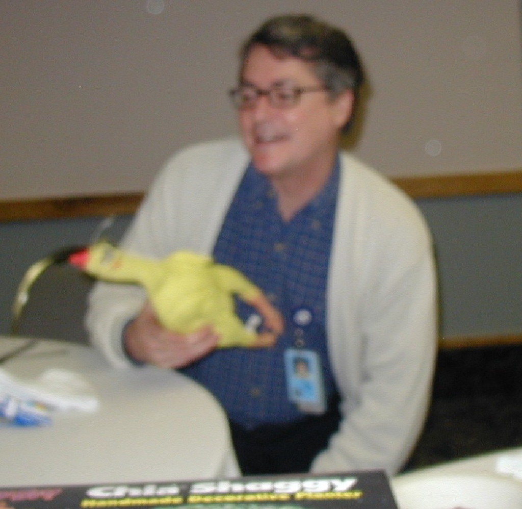 2002/12(December)/AAC-party/1024x768_2002-12-18-AAC-Xmas-gifts-07-Rob-takes-chicken.JPG
