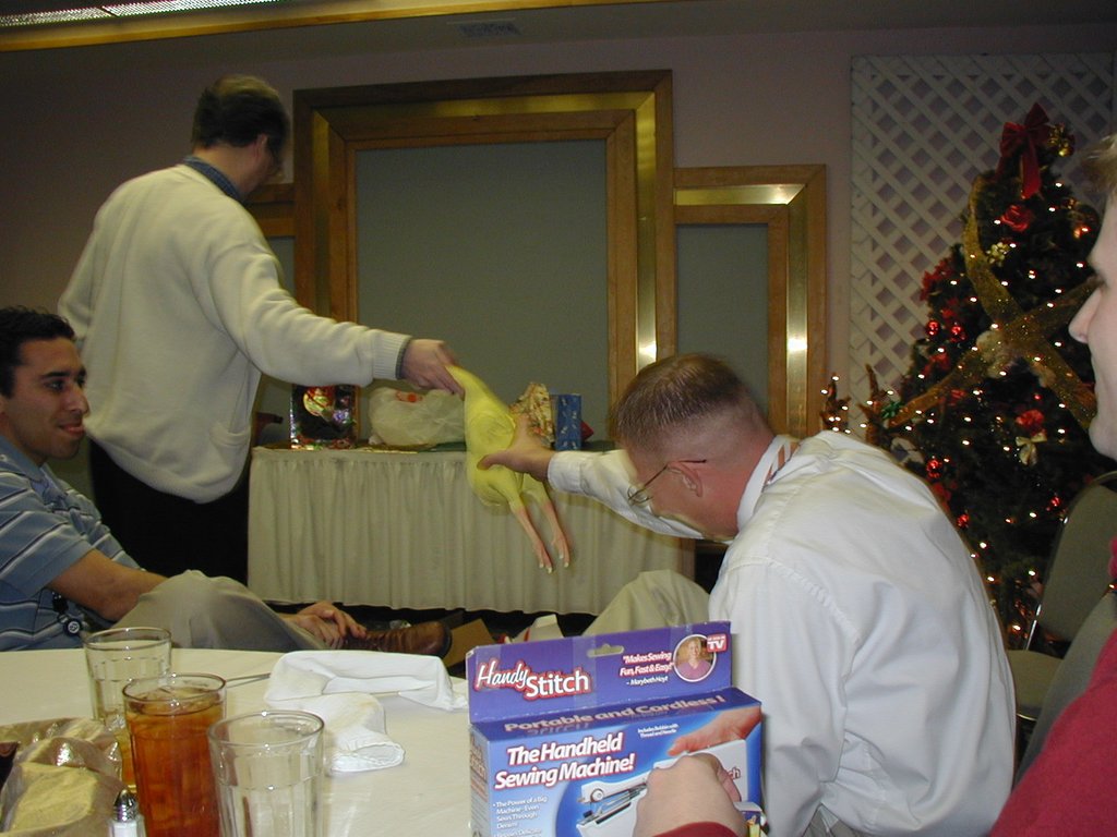 2002-12-18-AAC-Xmas-gifts-12-Ray-takes-chicken.JPG