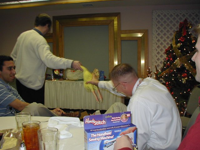 2002-12-18-AAC-Xmas-gifts-12-Ray-takes-chicken.JPG