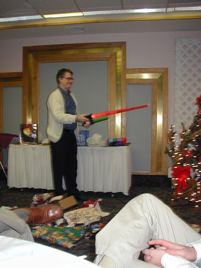 2002-12-18-AAC-Xmas-gifts-15-Rob-light-sabers.JPG