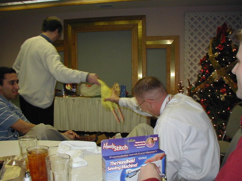 2002-12-18-AAC-Xmas-gifts-12-Ray-takes-chicken.JPG