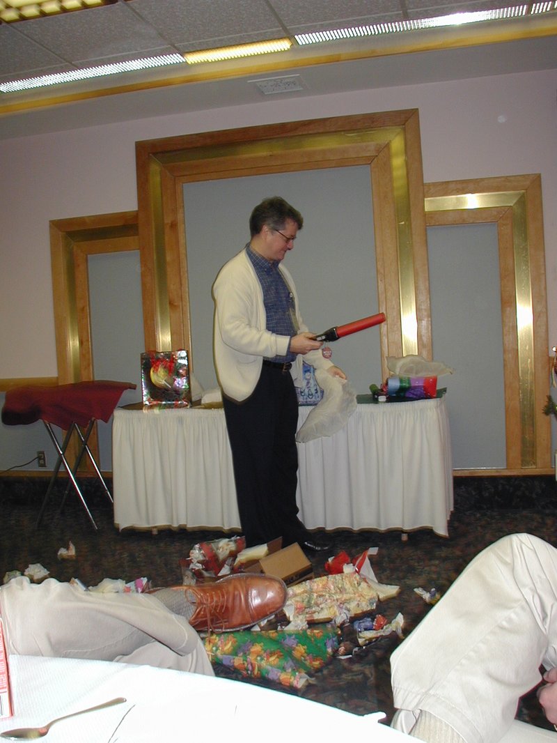 2002/12(December)/AAC-party/800x600_2002-12-18-AAC-Xmas-gifts-14-Rob-light-sabers.JPG