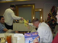 2002-12-18-AAC-Xmas-gifts-12-Ray-takes-chicken.JPG