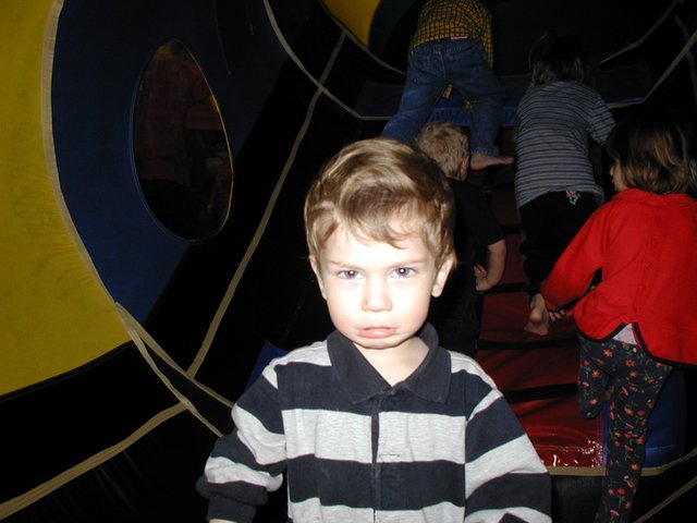2002-12-07-Aaron-bday-43-Dax-in-caterpiller.JPG