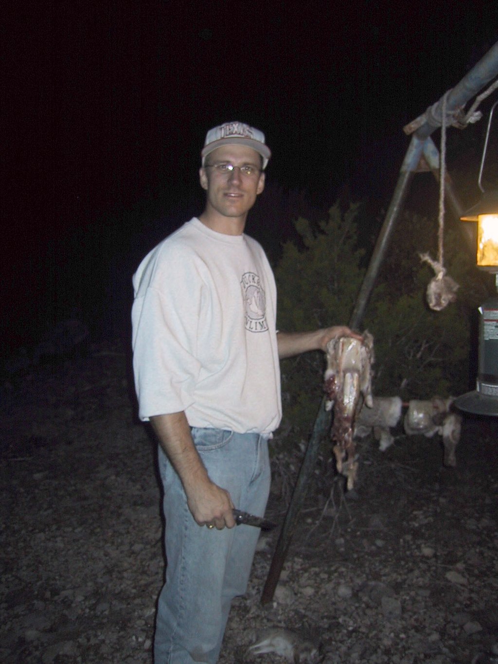 2002/12(December)/Hunting-Camping/1024x768_2002-12-12-Texas-Hunting-26-Travis-skinning-rabbits.jpg