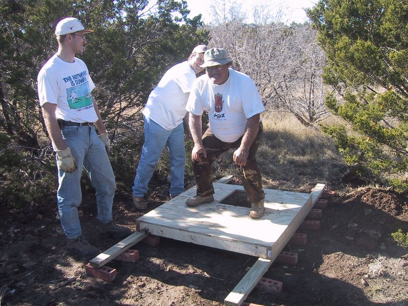 2002/12(December)/Hunting-Camping/800x600_2002-12-12-Texas-Hunting-15-Travis-Steve-Val-outhouse-stability-test.jpg
