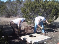 2002-12-12-Texas-Hunting-13-Val-Steve-outhouse-hole.jpg