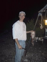 2002-12-12-Texas-Hunting-26-Travis-skinning-rabbits.jpg