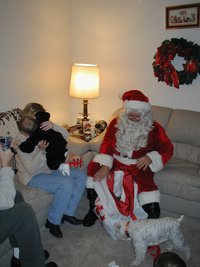 2002-12-24-Xmas-15-Santa-Kyla-squirms-away.JPG