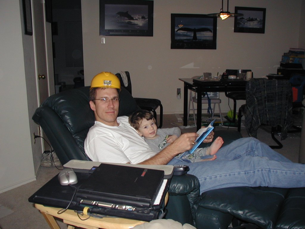 2003-02-09-Travis-reading-to-Dax-hardhat.JPG