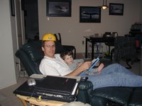 2003-02-09-Travis-reading-to-Dax-hardhat.JPG