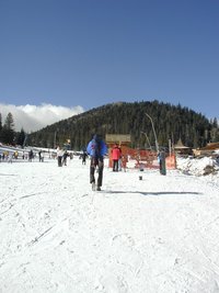 2004-01-18-Ruidoso-23-Dax-Travis-skiing-hiking-up-the-hill.JPG