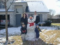 2004-02-14-Snow-in-Austin-26-Chance-Dax-Suzi-Travis-Snowman.JPG