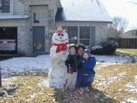2004-02-14-Snow-in-Austin-28-Chance-Dax-Marlene-Snowman.JPG