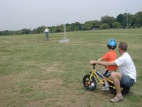 2004-04-04-Heather-Bday-11-Travis-Chance-watching-model-rocket.JPG