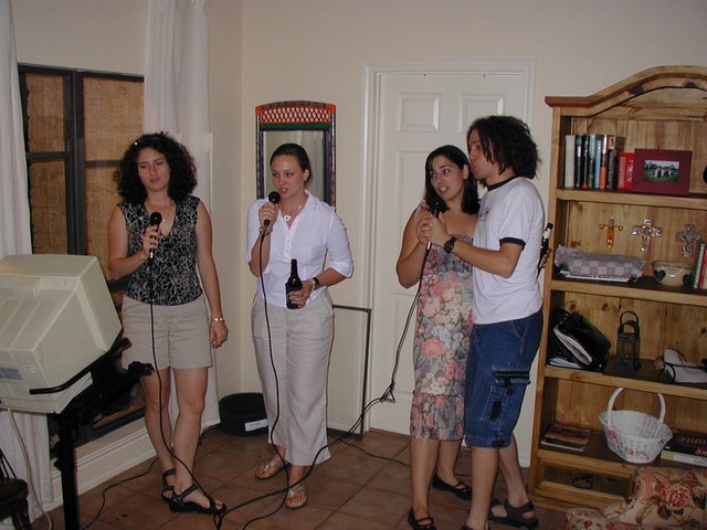 2004-05-21-Vanessa-graduation-party-3-karoake-Suzi-Mark.JPG