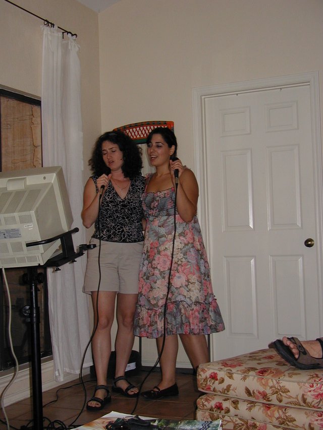 2004-05-21-Vanessa-graduation-party-5-karoake-Suzi.JPG