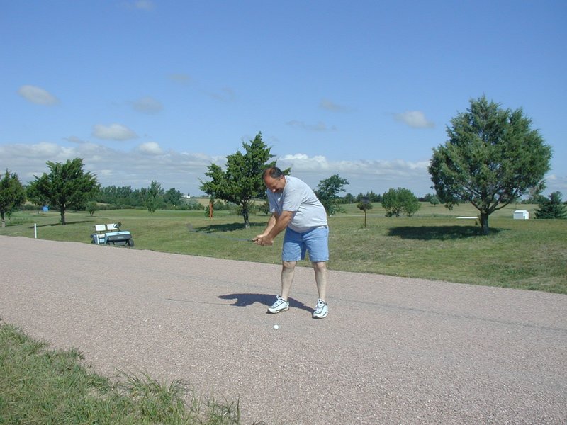 2004-07-30-Fish-Lake-Golf-09-John-on-dirt-road.JPG