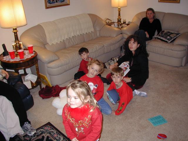 2004-12-24-Christmas-Eve-06-Suzi-reading-to-Vale-Kyla-Chance-Dax-Katie.JPG