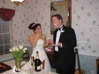 2005-03-18-Greg-Mariana-wedding-30-wearing-cake.JPG