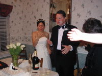 2005-03-18-Greg-Mariana-wedding-31-wearing-cake.JPG