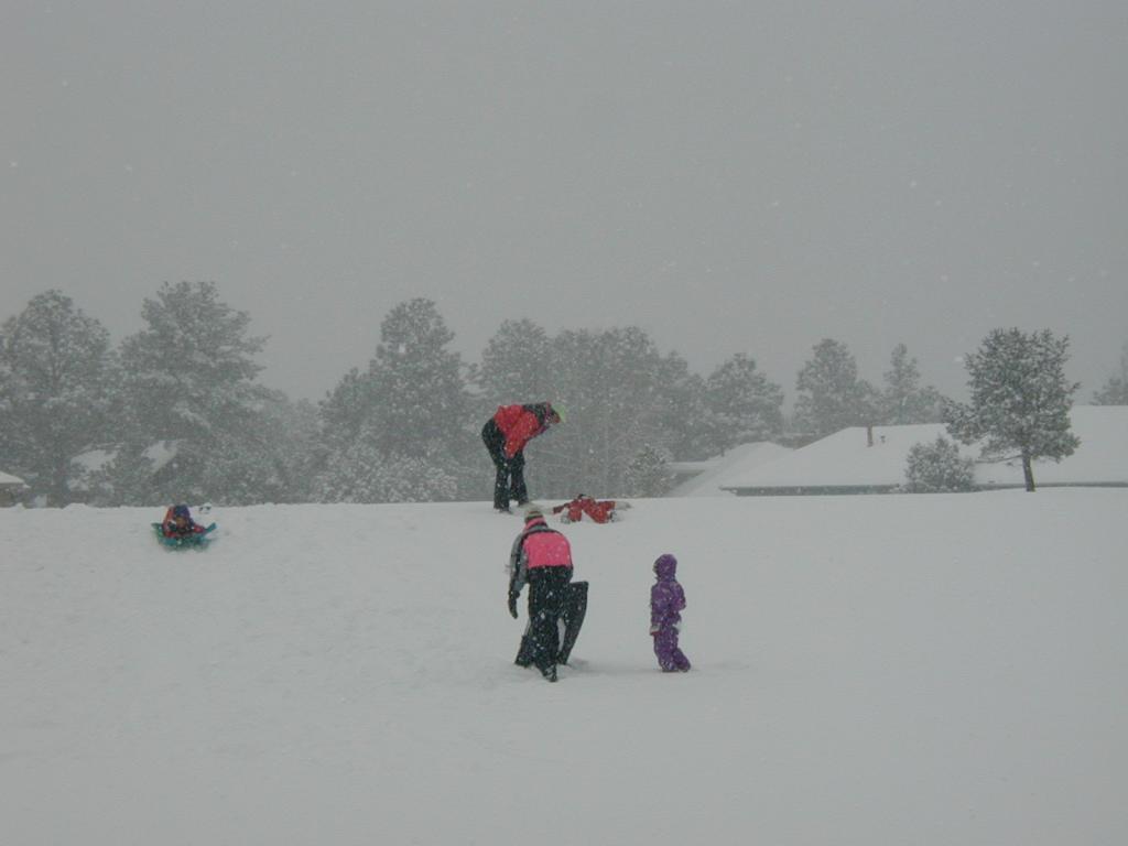 2005/03(March)/Ruidoso/Day3-snowed-in/1024x768_2005-03-15-Ruidoso-snowed-in-21-sledding-Dax-snow-angel.JPG