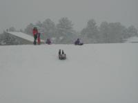 2005-03-15-Ruidoso-snowed-in-17-sledding-Ren.JPG