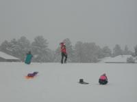 2005-03-15-Ruidoso-snowed-in-20-sledding-Dax-flying.JPG